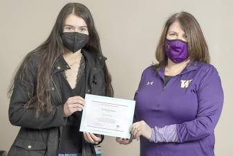 Warwick Valley High School Principal Marguerite Fusco presents senior Simone Sullivan with a Certificate of Merit for being named a finalist in the National Merit Scholarship program on Feb. 12. Photos by Tom Bushey/Warwick Valley School District.
