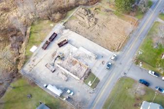 The South Street fire house was demolished late last month to make room for a new facility expected to open next fall. Ten years ago, the Warwick Fire District purchased the property next door, creating an area of naerly an acre for the new complex. Photos by Robert G. Breese.