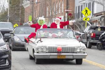 With various village festivities, including the horse and wagon rides, cancelled this season due to COVID-19, John Christison, the owner of Yesterday’s Irish Pub in Warwick, donned a Santa Claus outfit and together with the Grinch spread holiday cheer through the village in a classic 1962 Chevrolet convertible on Sunday, Dec. 13. Photo by Robert G. Breese.