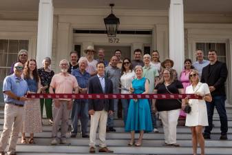 The ribbon-cutting for the reopening of Peach Grove House on June 5, 2025.