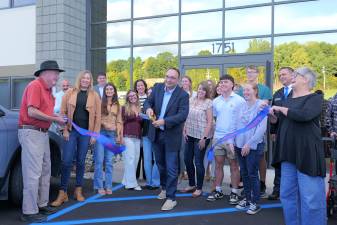 23 Marketing Group President and CEO Tony Morino cuts the ribbon celebrating the agency’s new office space alongside Orange County Executive Steven M. Neuhaus, Village of Florida Mayor Daniel Harter Jr. and members of the Florida Chamber of Commerce.