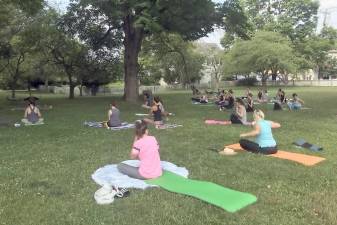Vastu Yogo Studios in Warwick and Greenwood Lake are hosting outdoor yoga classes in Lewis Park each day except Sunday. Here is the Friday morning class led by Vastu owner Aura Lehrer. Twenty-four people showed up for the socially distanced class. A drop-in fee is charged. The classes on Monday through Thursday are at 6:30 p.m. On Friday and Saturday, the classes start at 9:30 a.m. Photo by Linda Smith Hancharick.
