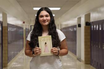 WVHS junior Isabella Costanza with her book, “Catch Me.”