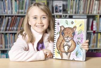 Park Avenue Elementary School third grader Alyssa Balsamo with a squirrel she drew in art class on Nov. 13, 2020.