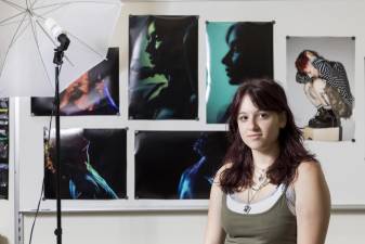 Warwick Valley High School senior Isabel Coppola poses with some of her photographs on Sept. 13, 2023.