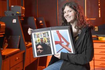 Warwick Valley High School senior Olivia De Melo with some of her photographs in the darkroom on Jan. 13, 2023. Photo provided by WVHS.