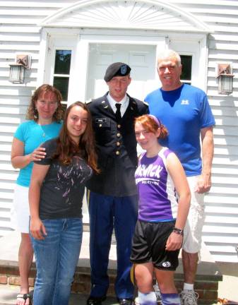 Photo by Roger Gavan West Point graduate home on leave with his family: From left, mother Ann Prial, his sister Brigid, U.S. Army Lt. Daniel Prial, his sister Jenny and father Greg Prial. Not available for the photo: Lt. Prial's sister Becky who is married and lives in New Paltz, NY and his brother Terrance who works in Washington, DC. # # #