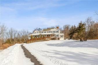 Big house, barn, pastures and mountain views