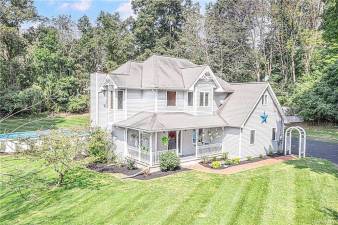Three levels with lovely details and new custom features on 1.4 country acres with pool