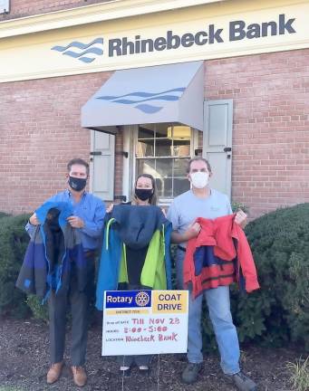 Rhinebeck Savings Bank in Goshen served as a collection point for donations to Goshen Rotary Club’s winter coat drive. Pictured from left to right: Michael Peters , the resource exchange coordinator for Catholic Charities of Orange, Sullivan and Ulster, accepted the donation of coats from Goshen Rotary Club member Amy Van Amburgh and Club President Mark Gargiulo.