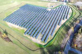 An aerial view of the Warwick Valley School District's solar power facility, located on rolling field downhill from Sanfordville Elementary. Since being activated in February 2018, solar power has generated enough energy to cover 75 percent of the district's electrical energy costs.