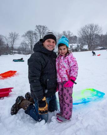 Aaron Sibenac of Warwick and his daughter Romy Sibenac, 4, joined in on the fun. Romy’s snow gear included her pair of stylish, hot pink gloves and a blue/green marbled toboggan sled.