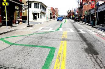 The leprechauns who paint a somewhat crooked green line down Main Street for St. Patrick’s Day each year arrived a day early.