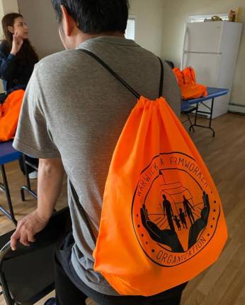 The safety backpacks are filled with a variety of items to help keep farmworkers safe from the elements, visible to passing cars, and hydrated, to name a few.
