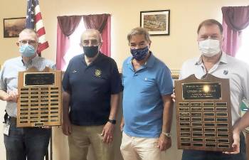 Rotarians are seeking nominations for Warwick’s 2020-2021 Citizen of the Year. Committee members include, left to right: Master of Ceremonies Michael Sweeton with the Jaycee plaque honoring winners from 1968-1999; Co-chairs Leo Kaytes Sr. and Stan Martin; and Warwick Rotary President Ed Lynch, holding the Rotary plaque listing recent winners. The Warwick Citizen of the Year plaques are displayed at Town Hall. Photo by Ana Kanz.