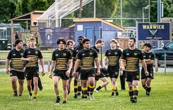Declan Tobin (third from left) taking the field with Highlander Rugby team in the spring of 2023.