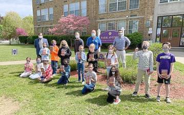 Fourth-grade students at Park Avenue Elementary School enjoy dictionaries provided by the Warwick Valley Rotary. Standing from the left, Principal Bill Biniaris and Rotarians: President-Edward M. Lynch, Vice President-Neil Sinclair and Event Coordinator-Ryan O’Leary. Every fourth-grader in the Warwick School District was given a dictionary courtesy of the Rotary Club, and in the event, the Club reviewed the importance of community service. Photo provided by Chris Olert.