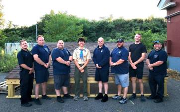 From left to right: Lieutenant Charlie Moore, Lieutenant Joe Schweizer, Past Chief Andrew Lemin, Eagle Scout Holden Frommeyer, 1st Assistant Chief Kevin Hughes, 2nd Assistant Chief Marc Roe, Captain Austin Courtney, Firefighter Scott Lemin.
