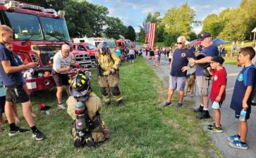 The Warwick Fire Department will be participating in National Night Out. Pictured are firefighters giving a demonstration at the event last year. Unless noted otherwise, all photos are by Jennifer O’Connor.