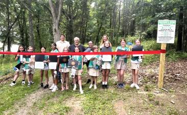 Members of Troop #514 celebrate the opening of community exercise stations at Glenmere Lake Park.