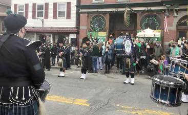 Members of the Pipes and Drums of the Orange County Ancient Order of Hibernians marched down Main Street, stopping in front of well-decorated Yesterday’s Pub to entertain the public. Provided photo.