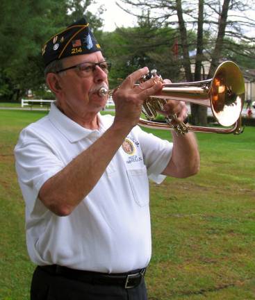 Tony Cosimano played "Taps" and shortly afterwards, the crowd dispersed in silence.