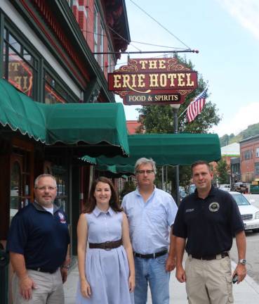 Provided photo From left to right are: Orange County Legislator Tom Faggione, Historian Johanna Yaun, Matt Kierstead of Milestone Heritage Consulting, and Orange County Executive Steven M. Neuhaus at The Erie Hotel and Trackside Manor in Port Jervis. The Erie hosted a Tavern Trail series event last year.