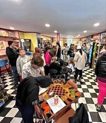 After the ribbon cutting, patrons exploerd the games and gifts the new shop had to offer.