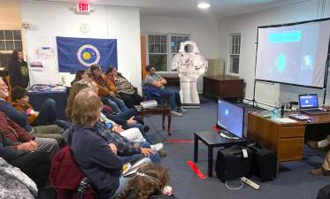 The crowd listened intently to the discussion.