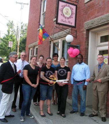 Photo by Roger Gavan Public officials and representative of the business community joined Abigail Stever and Melissa Schultz for the official grand opening of the Village of Warwick retail outlet of Eat Sweet Bakery. Front from left: Mayor Michael Newhard, Eat Sweet employee Allana Gauzza, Melissa Schultz, Abigail Stever, Cedric Glasper, president of the Warwick Valley Chamber of Commerce, and Town of Warwick Supervisor Michael Sweeton; and in back: Warwick Valley Chamber of Commerce Executive Director Michael Johndrow, board member Susan Ronga and Vice President Sherry Bukovcan.