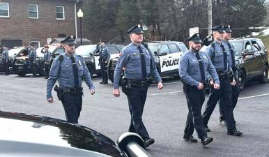 Officer Stephen Pascal walks out of the department upon his official retirement from full-time patrolling.