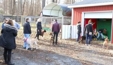 Pet owners line up at the Warwick Valley Humane Society’s Animal Shelter last year for its annual “Pet photos with Santa