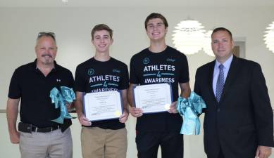 From left: Chairman of the Orange County Legislature Steve Brescia, chair of the Orange County Legislature; Holden Lee; Cory Lee; and Steve Neuhaus, Orange County Executive, at the county government center on Aug. 13.