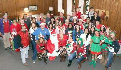 Members of the Warwick Valley Rotarians, who hosted the second of two Rotary and Lions back-to-back parties, along with Santa and his many volunteer elves.