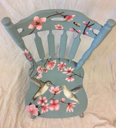 Dorothy Finney painted these humming birds for her contribution to the Chair Auction fund raiser.