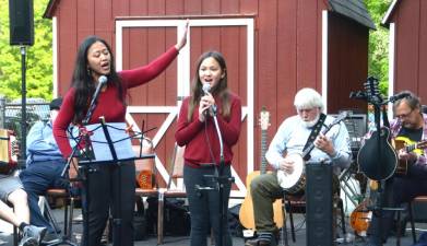 Nita Clifford (l) and her daughter, Skylar, 11, sing “The Skye Boat Song” during the Warwick Valley Irish Ballad &amp; Trad Sessions at the Greenwood Lake American Legion on May 21, 2023.