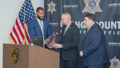 Investigator Jonathan Kitsos is presented with the ATF NY Task Force Leadership Award by Resident Agent in Charge Kelvin Jackson and Special Agent in Charge Bryan DiGirolamo.