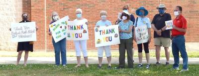 A group of Backpack Snack Attack volunteers cheer for the Warwick Valley High School “Road Warriors” on the last day of meal deliveries. Photo provided by Louise Hutchison.