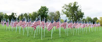 The sea of flags flying with plaques identifying each local hero. File photo by Roger Gavan.