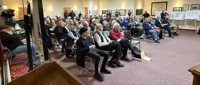 This is a photo of the crowd at the Warwick Town Planning Board April 16. The writer of the post below estimated at least 170 people were there. “Some attendees left because there was nowhere to sit. Others remained standing outside the meeting room listening by the doorways.” Photo by Peter Lyons Hall.