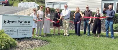 On Thursday, Aug. 26, members of the Warwick Valley Chamber of Commerce joined Syrena Wellness owner Aggie Pindral, Dr. Alina Segura-Bustamante, Dr. Mikhail Intingen (cutting ribbon) and staff members, to celebrate the expansion and new location with a ribbon-cutting ceremony. Photo by Roger Gavan.