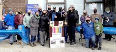 On Saturday, Jan. 23, members of the Warwick Valley Rotary Club, under the direction of its President, Edward Lynch (center) distributed 7,000 masks to representatives of local communities and organizations assembled outside St. Anthony Community Hospital. Provided photo.