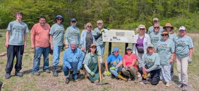 Volunteers lend a hand at the 2025 “I Love My Parks Day.” Pictured standing by the sign: Eli Hart, Jennifer Weiss, Pam Breeman, Terryanne Gmelch. Kneeling: Michele Lindsay and Susan Christensen.