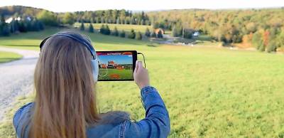 The new augmented reality tour lets visitors view the historic site as one of 450,000 during the 1969 Woodstock festival. Photo by Kevin Ferguson.