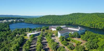 Office buildings in the foreground sit on Jehovah’s Witnesses recently acquired property in Warwick. The group’s world headquarters can be seen on the far left.