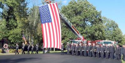 The presentation of the colors early last Saturday evening, Sept. 11, at Veterans Memorial Park. Photos by Roger Gavan.