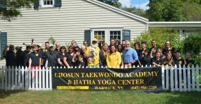 The Chosun Taekwondo Academy Leadership Team with Warwick Mayor Michael Newhard and Lions Club members. Photo provided