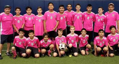 Standing, from left to right,are: Coach Roberto, Carlos, Antonio, Luke, Anthony, David, Coach Ricardo, Ethan, Julio, Joshua and Coach Carmelo; and in front: Santiago, Jesse, Giovanni, Ryan, Mackery, Kenai, Omar and Jesus.