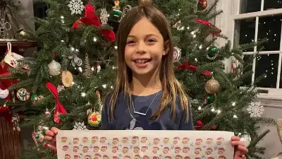 2021 contest winner Avery with her winning artwork printed as wrapping paper. File photo.