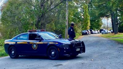 The New York State Police kept Newport Bridge Road closed Sunday morning as the investigation into a murder-suicide continued.